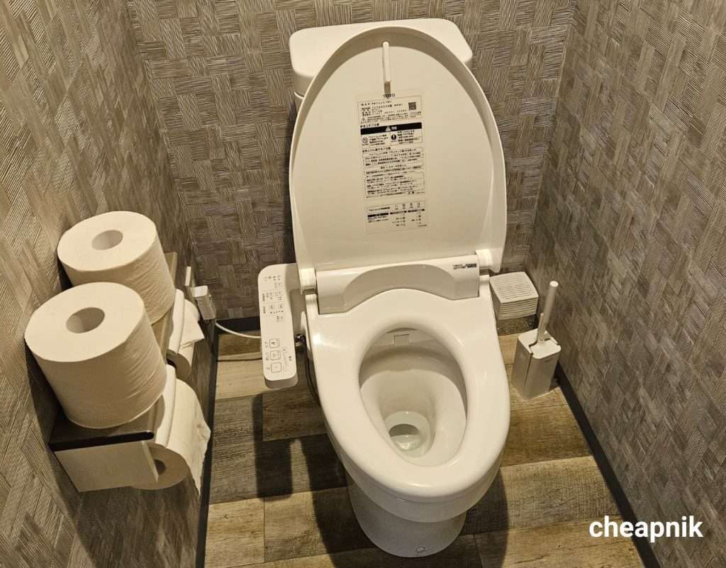 Modern Japanese-style private toilet at Hotel Tomariya Ueno in Tokyo