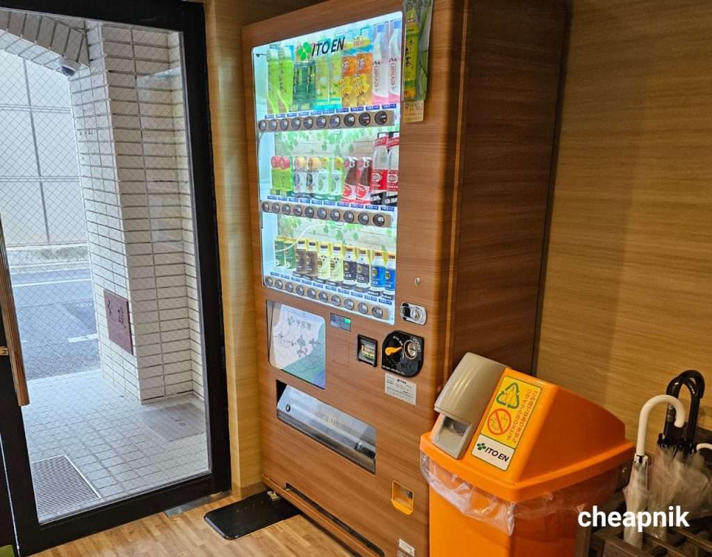 Vending machine serving hot and cold drinks at Hotel Tomariya Ueno in Tokyo