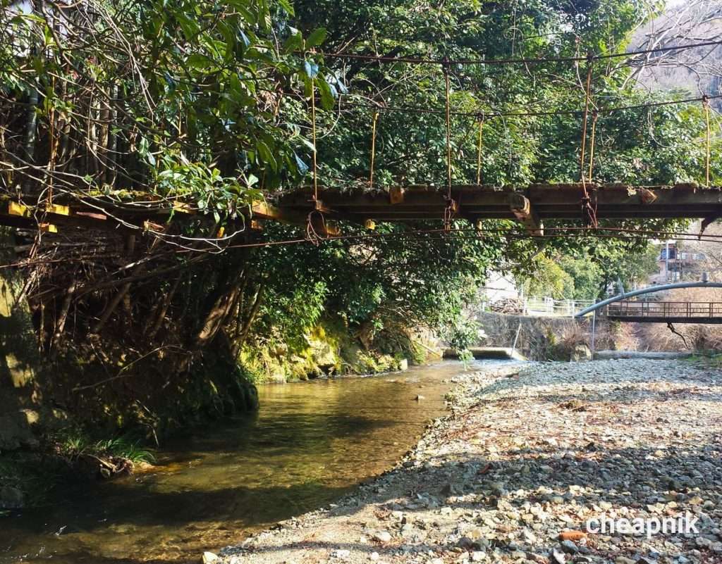 Amami Onsen Nanten-en Ryokan_Old wooden bridge crossing the river
