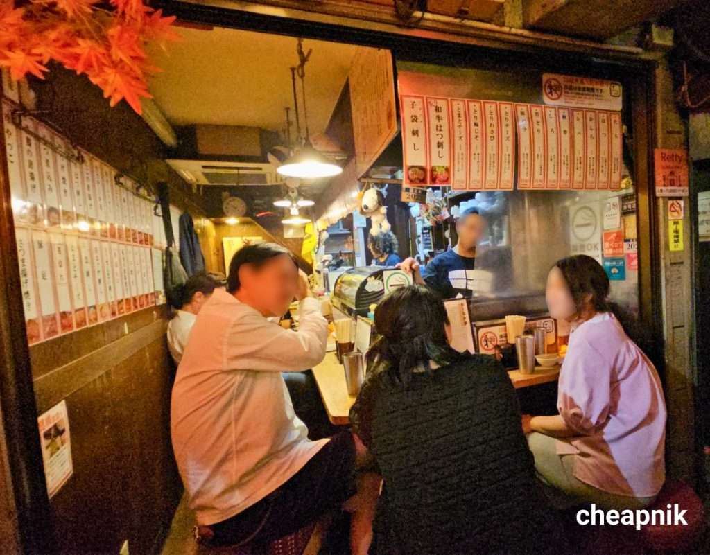 Omoide Yokocho_Patrons enjoying a night out at Horaiya 1 izakaya in Piss Alley