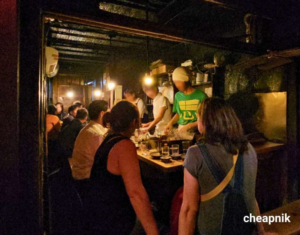 Omoide Yokocho_Patrons enjoying a night out at Sasamoto izakaya in Piss Alley