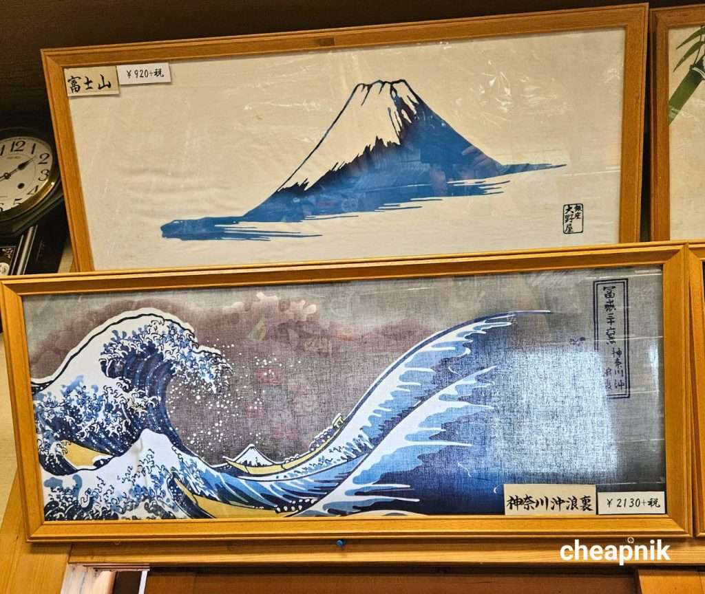Tenugui with Mt Fuji and Crashing Waves Hokusai design on display at Ginza Oonoya in Tokyo