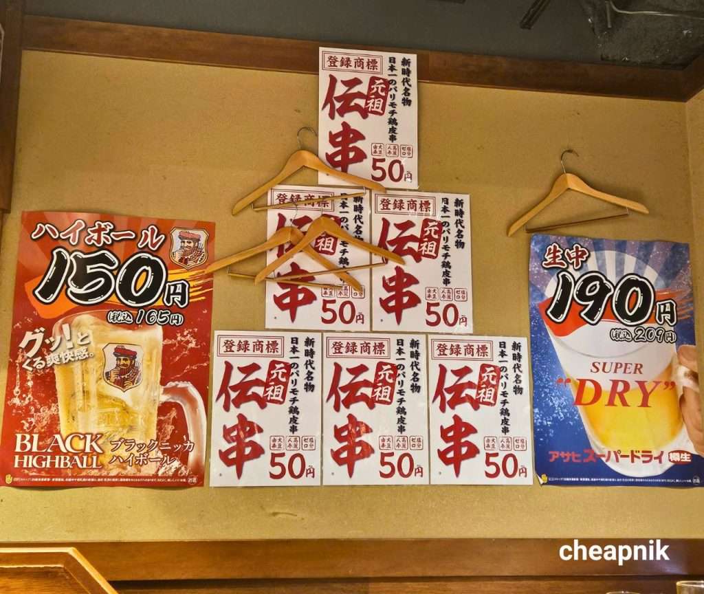 Cheap Chicken Skewers, Highball and Beer posted on Shinjidai Izakaya's walls