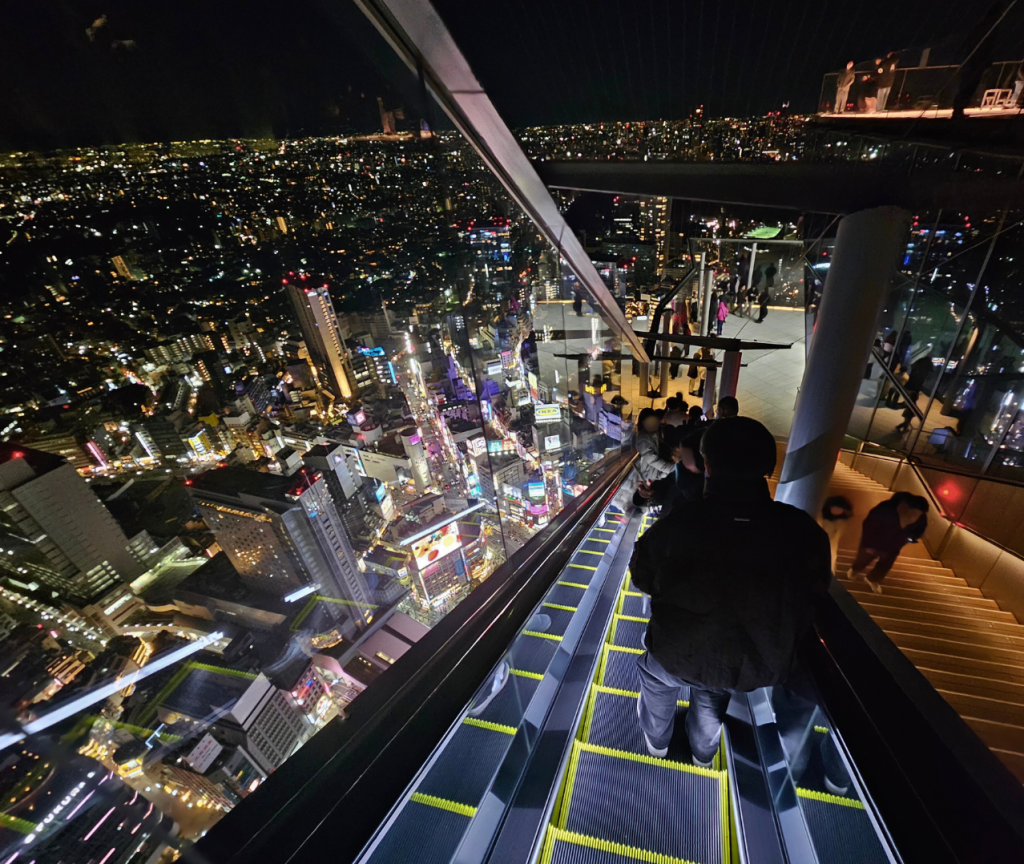 Nighttime view from the glass escalator at Shibuya Sky