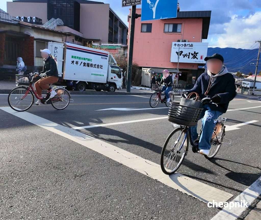 Tourists riding a bike rental around Kawaguchiko Station
