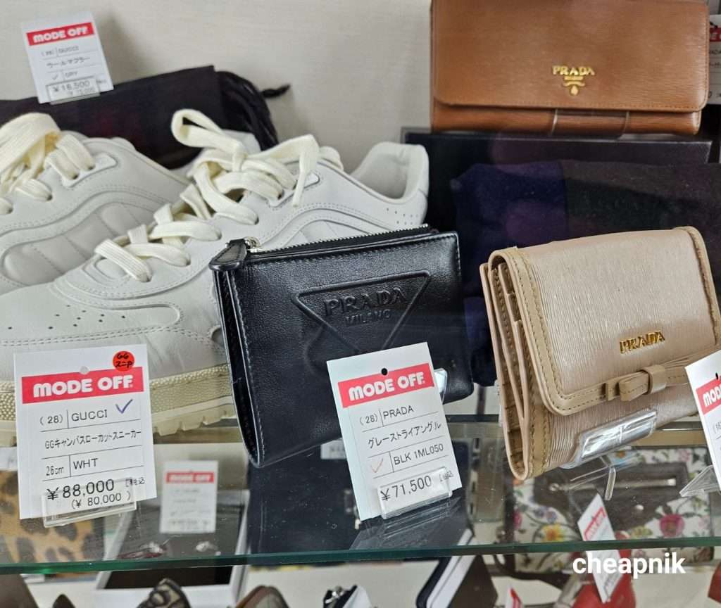 Used Gucci shoes and Prada wallets for sale at Mode Off