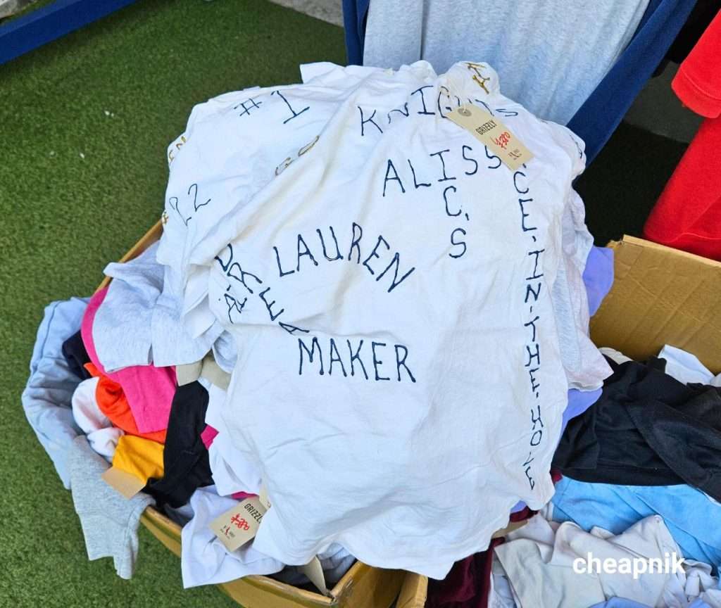 Plain white shirt with writings on a clearance bin in Shimokitazawa