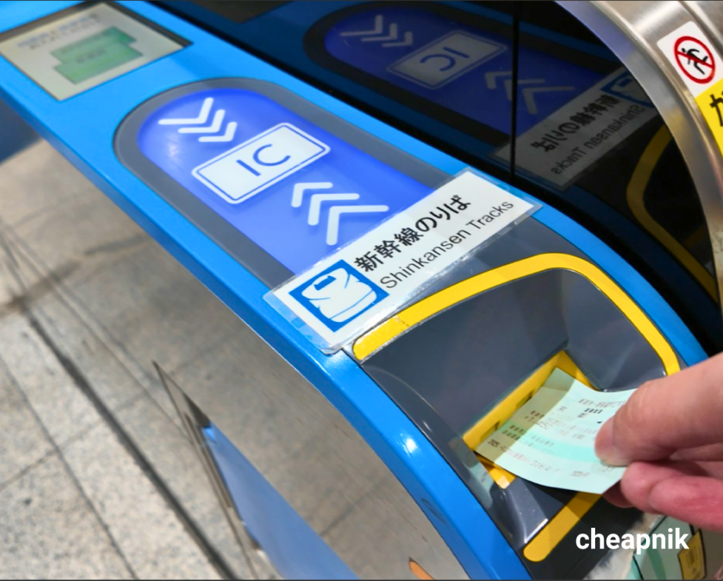 Inserting ticket in Shinkansen Tracks gate