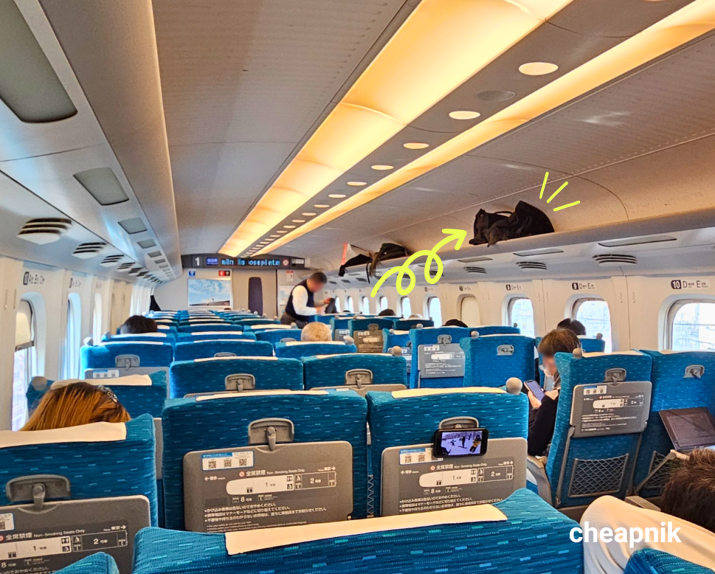 Overhead luggage space inside the Shinkansen